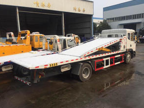 What are the specifications of the towing trucks?